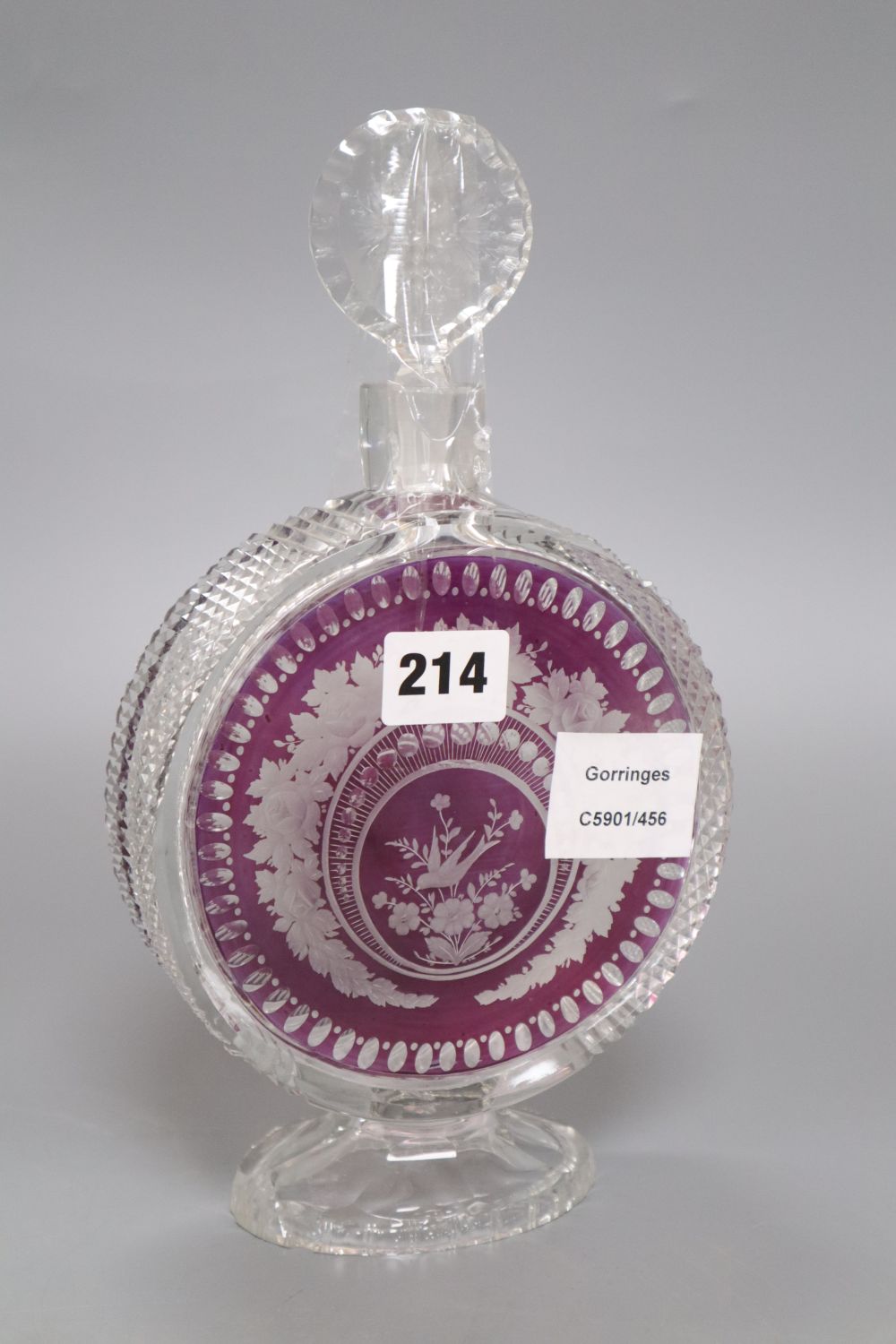 An amethyst overlaid cut glass decanter, height 27cm (a.f.)